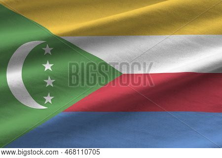Comoros Flag With Big Folds Waving Close Up Under The Studio Light Indoors. The Official Symbols And