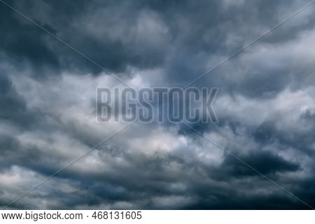 A Dark Blue Cloudy Sky. Cumulus Clouds. Nature Background. Bad Weather Forecast. Before A Thundersto