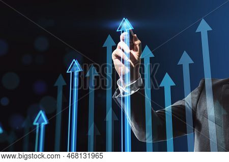 Business Success And Investing Concept With Man Hand Using Stilus On Digital Touch Screen With Blue 