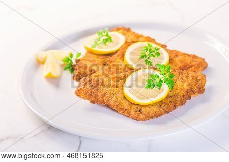 Breaded Fish, Baked And Served With Lemon. Common Dab, Edible Flatfisch (limanda Limanda)