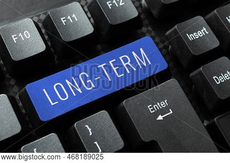 Hand Writing Sign Long Term. Business Overview Occurring Over Or Involving A Relatively Long Period 