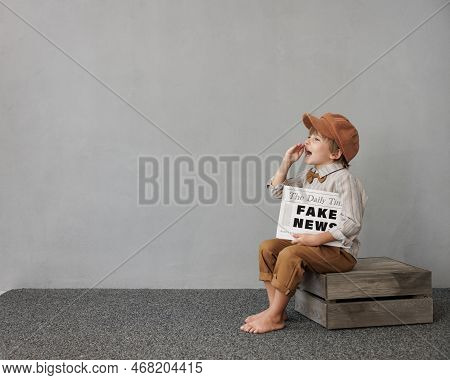 Newsboy Shouting Against Grunge Wall Background. Boy Selling Fake News