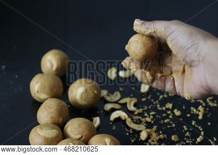 Preparation Of Moong Dal Laddu In A Ball Form With Hand. It Is A Protein Rich, Indian Sweet Made Of