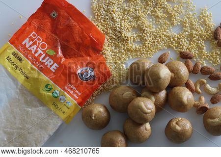 Moong Dal Laddu Shot Along With Yellow Moong Dal In A Pro Nature Organic Orange Packaging