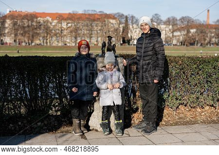 Uzhgorod, Ukraine- January 2, 2023: Kids Near Buffalo Bill Wild West Mini Sculptures.