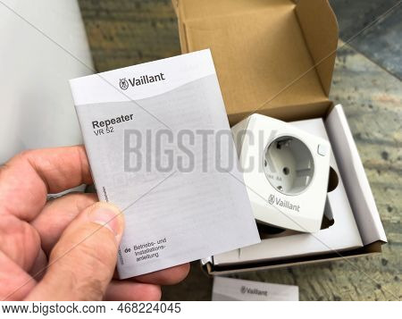 London, United Kingdom - Jan 1, 2022: Pov Male Hand Holding Manual Peper Booklet Of New Vaillant Amb