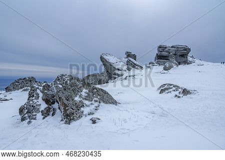 Rocks On The Top Of Mount Alenga. Southern Demerdzhi In Snow And Ice Early Spring. Crimea