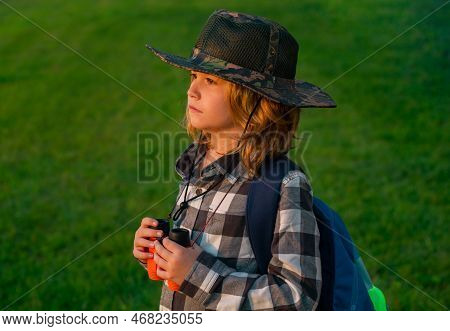 Scout Boy Wearing Explorer Hat And Backpack Outdoor. Explorer And Adventure With Binocular.
