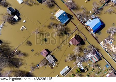 Aerial View Of The Flooded Suburban Areas During The Spring Flood. Houses In The Water During The Fl