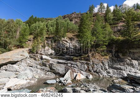 Karst Granite Rocks Protruding To Surface With Small Water Pool Formed By Lillaz Waterfall (cascate 