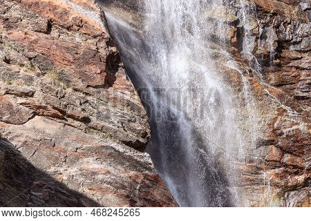 High-contrast, Bright Close Shot Of Churning Water Of Lillaz Waterfall (cascate Di Lillaz) Over Kars