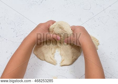 Childrens Hands Sculpt Salty Dough. Development Of Fine Motor Skills Of The Hands. Development Of Ch
