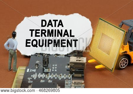 Computer Concept. On The Board With Microcircuits Lies A Paper Plate With The Inscription - Data Ter