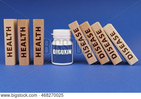 Medical Concept. On A Blue Background, Wooden Plates With The Inscription Health And Disease, In The