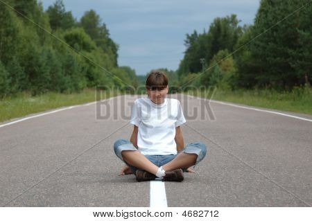 Girl Sitting On Road