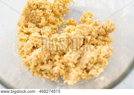 Mixing Ingredients In A Glass Mixing Bowl To Prepare Mermaid Cakesicles.