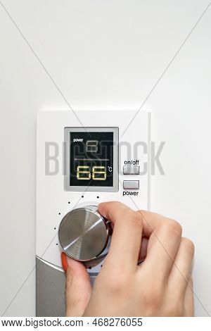 Gas Boiler. A Woman Regulates The Temperature With A Temperature Controller. Setting The Room Temper