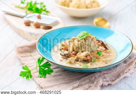Homemade Bavarian Bread Dumpling, Called In South Germany As Semmelknoedel With Creamed Mushroom Sau