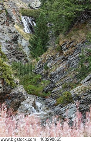 Alpine Lillaz Waterfall (cascate Di Lillaz) Rushes Along Granite Gorge Covered With Green Forest And