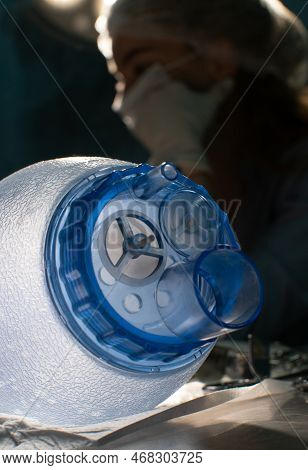 A Beautiful Close-up Of The Ambu Bag Against The Background Of A Doctor In Surgery. The Oxygen Bag L