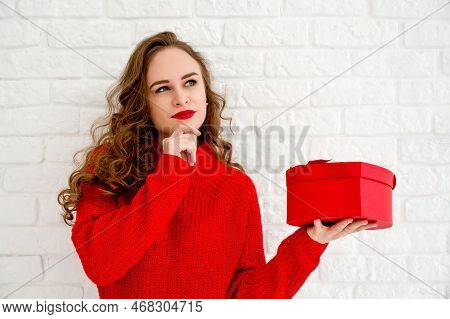 Smiling Woman Againt Wall Background In Red Swaeter With Heart Gift Box. Valentines Day Banner With 