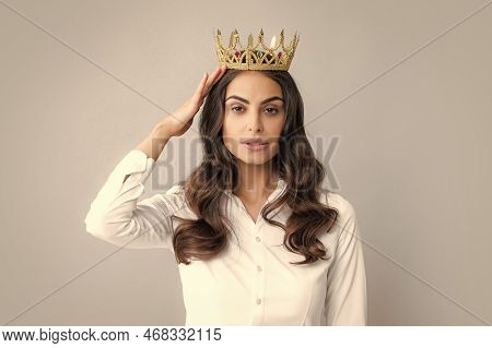 Portrait Of Arrogance Woman With Golden Crown On Head, Leadership And Success. Attractive Rich Arrog