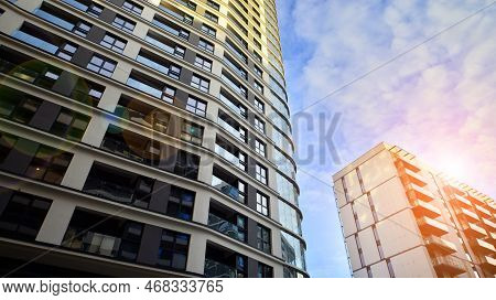 The Narrow Passage Between Modern Residential Buildings. Walls Of High-rise Apartment Buildings And 