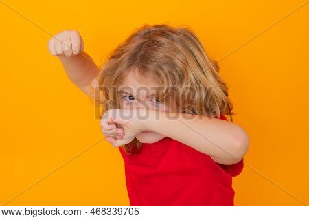 Andry Boy In Red T-shirt Making Stop Gesture On Isolated Studio Background. Kid Showing Warning Symb