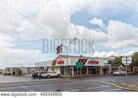 Bredasdorp, South Africa - Sep 23, 2022: A Street Scene, With An Automotive Business, In Bredasdorp 