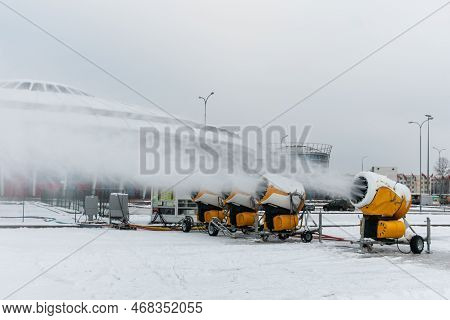 Snow Cannons Spray Artificial Snow Crystals. Production Of Artificial Snow. Cars Make Snow. Snow Gun