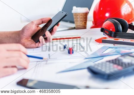 Close Up Man Hand Working Of Architect Sketching Project On Blueprint At Site Construction Work.