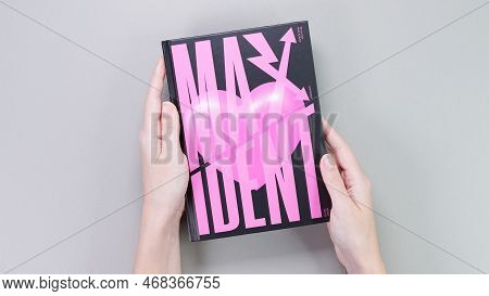 Hands Holding Stray Kids Maxident Mini Album Box Set On Grey. Pink Music Cd. South Korean Boy Band S