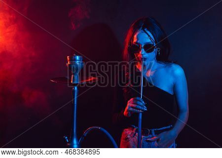 Hookah Atmosphere. The Girl Enjoys Smoking A Hookah, Sheesha.