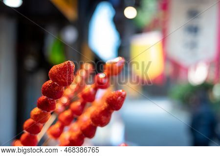 Tanghulu Traditional Chinese Hard Caramel Coated Strawberry Skewers Close-up