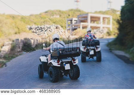 Group Of Riders Riding Atv Vehicle Crossing Mountain Serpentine Road Track, Process Of Driving Renta