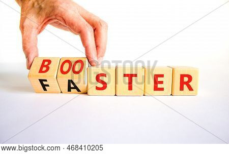 Booster And Faster Symbol. Concept Word Booster Faster On Wooden Cubes. Businessman Hand. Beautiful 