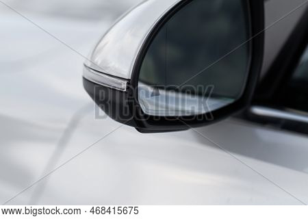 Modern Car Bcw System. Blind Spot Warning Indicator On The Car Rearview Mirror. Blind-spot Collision