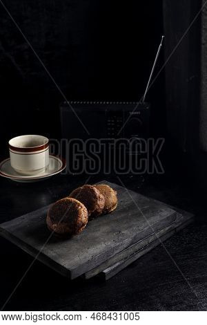 Apang Bale Cake Or Apang Bakar, And A Cup Of Tea Isolated On Black Background. Indonesian Cake