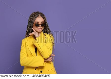 Beautiful Woman With Long African Braids And Sunglasses On Purple Background, Space For Text