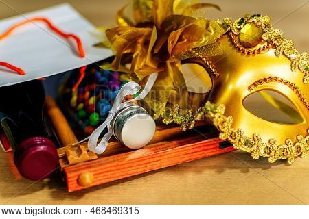 Purim Holiday Concept With Carnival Mask, Noisemaker, Confetti, Wine, Party Costume.