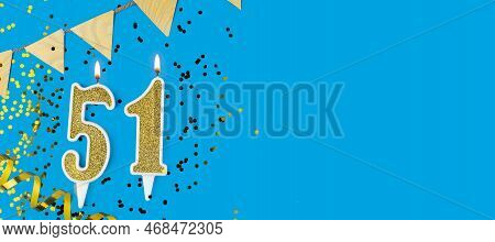 Golden Candle Number Fifty One. Birthday Or Anniversary Card With The Inscription 51. Blue Backgroun