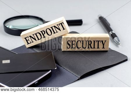 Endpoint Security Text On A Wooden Block On Black Notebook , Business Concept