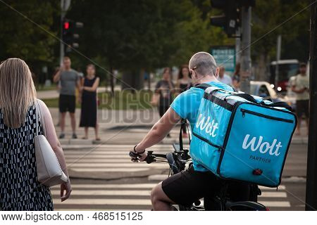 Belgrade, Serbia - July 7, 2022: Wolt Delivery Man Driving In Belgrade With His . Wolt Is A Finnish 