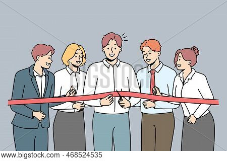 Excited Business Team Cut Ribbon Open Office Or Enterprise Together. Smiling Businesspeople At New W