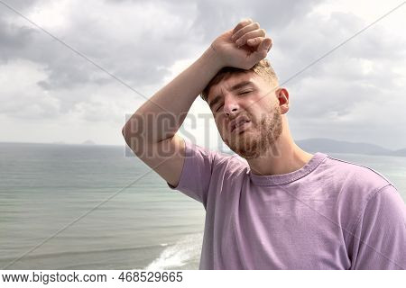 Guy Is Suffering From Heat, Man With Heatstroke. Having Sunstroke At Summer Hot Weather. Dangerous S