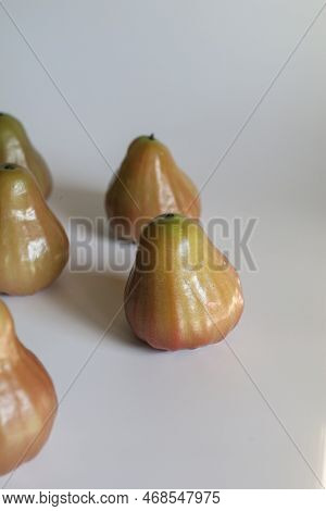 Freshly Rose Apple Or Chomphu Fruit On White Background. The Fruits Are Sweet And Red Or Green.