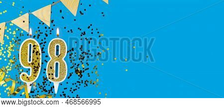 Golden Candle Number Ninety Eight. Birthday Or Anniversary Card With The Inscription 98 On Blue Back