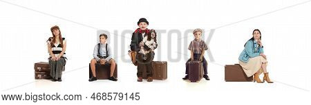 Young Woman, Man And Kids Sitting On Vintage Suitcase With Deay Look Isolated Over White Background.