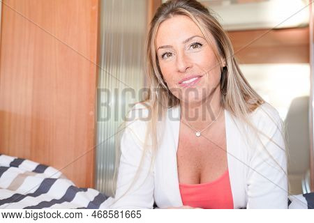 Beautiful Smiling Woman In Interior Motor Rv Campervan Home Van In Vanlife Concept