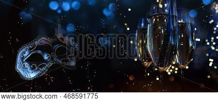Venetian Carnival Mask With Champagne In Front Of Luminous Night Sky With Festive Bokeh.